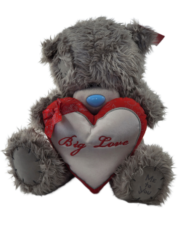 Plush bear with red heart
